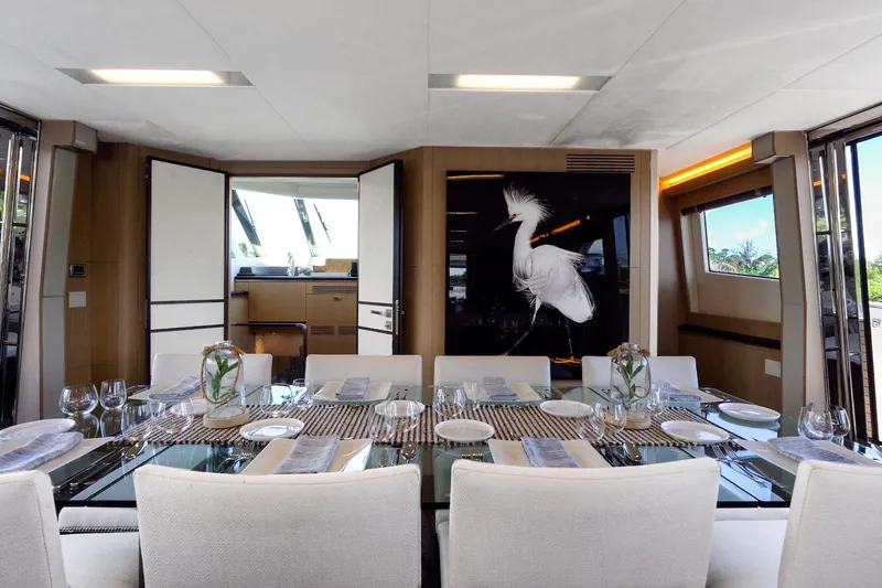 Slide: The Image of Luxurious dining area on 2015 Monte Carlo Yachts MCY 86 with elegant table setting. - 53