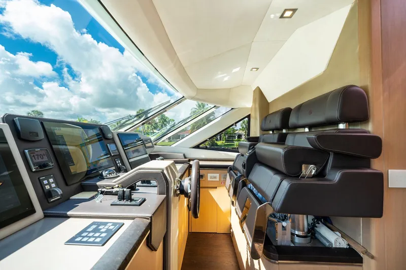 Slide: The Image of Luxurious 2015 Monte Carlo Yachts MCY 86 helm with modern navigation equipment and leather seating. - 55