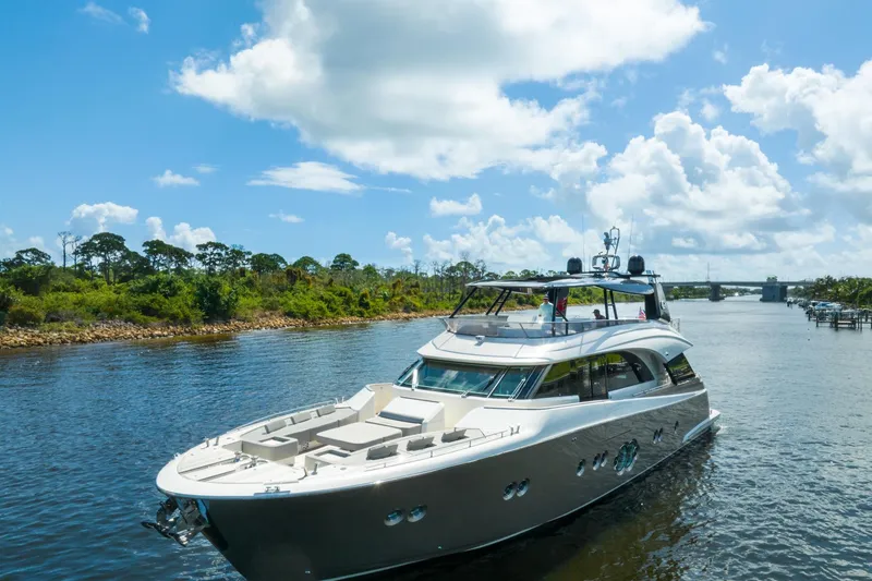 Slide: The Image of Luxurious 2015 Monte Carlo Yachts MCY 86 cruising on a scenic waterway. - 6