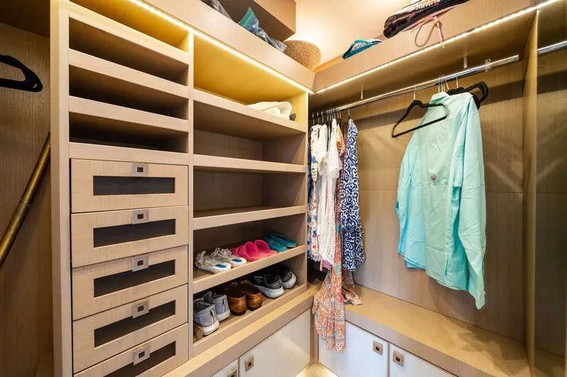 Slide: The Image of Luxurious walk-in closet on 2015 Monte Carlo Yachts MCY 86, featuring organized shelves and hanging space. - 60