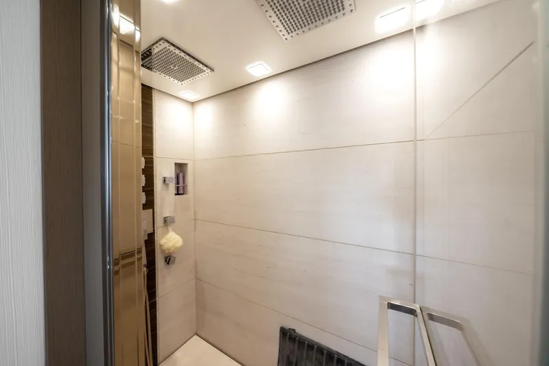 Slide: The Image of Luxurious shower area in 2015 Monte Carlo Yachts MCY 86, featuring modern fixtures and lighting. - 62