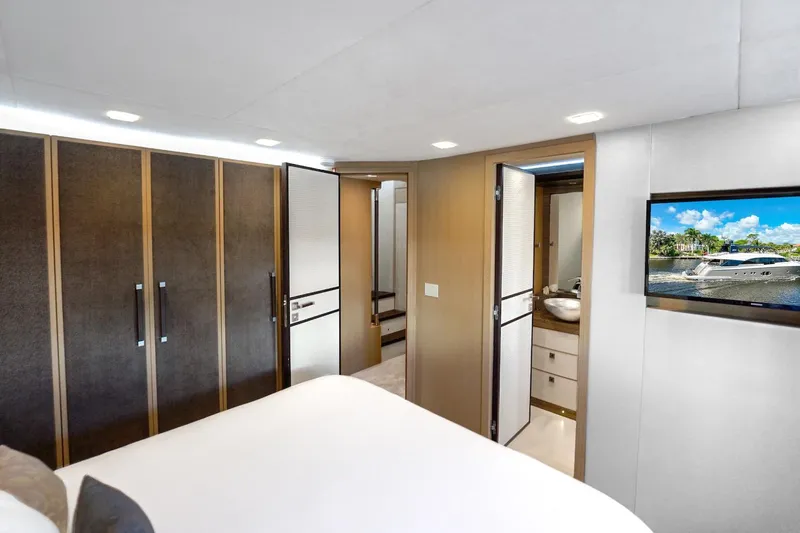 Slide: The Image of Luxurious bedroom interior of 2015 Monte Carlo Yachts MCY 86 with modern amenities. - 63