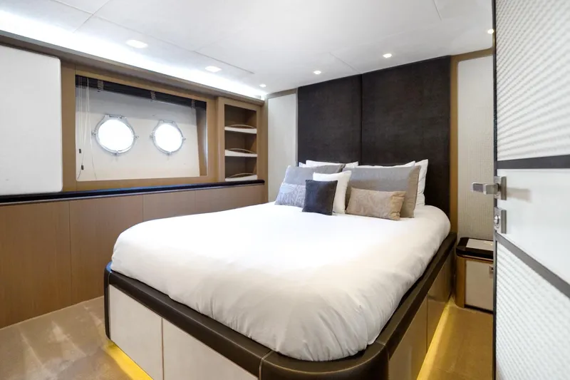 Slide: The Image of Luxurious bedroom interior of 2015 Monte Carlo Yachts MCY 86 with modern design and porthole windows. - 65