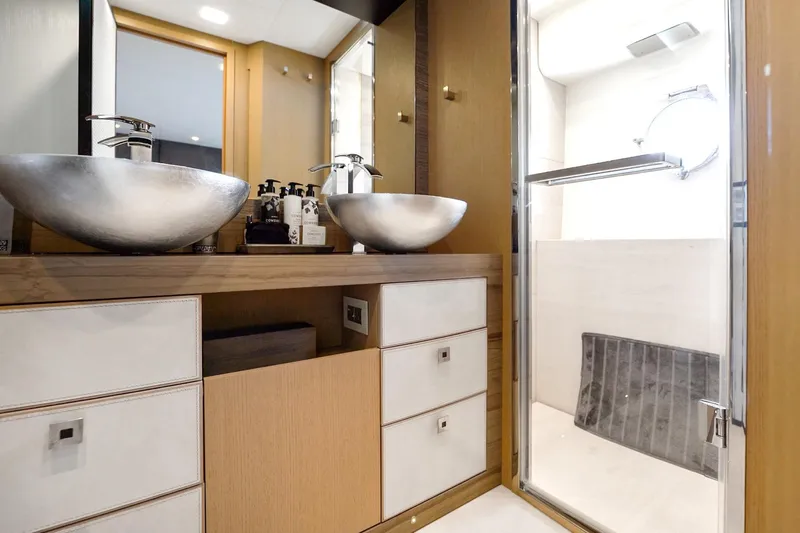 Slide: The Image of Luxurious bathroom interior of 2015 Monte Carlo Yachts MCY 86 with modern sinks and shower. - 66
