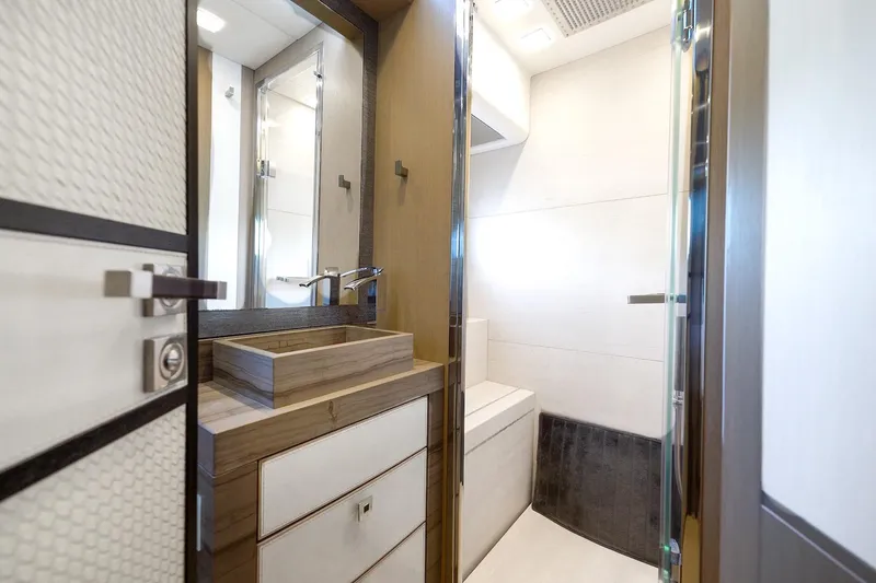 Slide: The Image of Luxurious bathroom interior of 2015 Monte Carlo Yachts MCY 86, featuring modern fixtures and elegant design. - 72