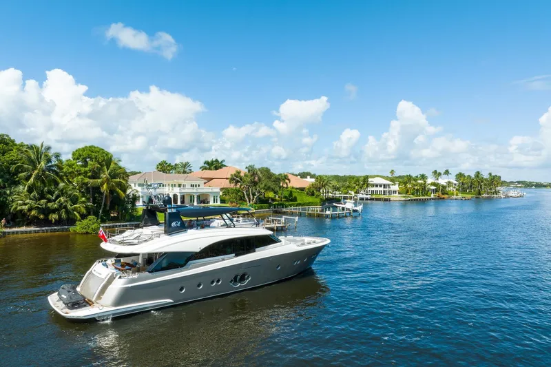 Slide: The Image of Luxury Monte Carlo Yachts MCY 86 cruising near waterfront homes, 2015 model. - 8