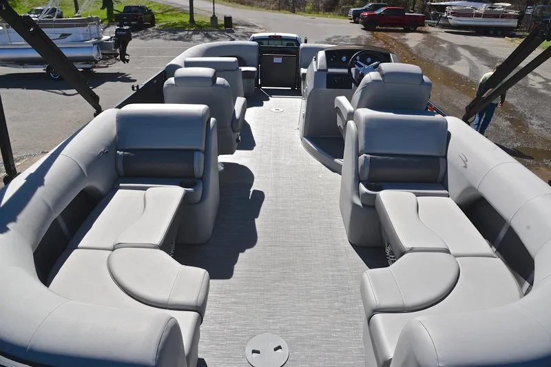 Slide: The Image of 2022 Bennington 22 L pontoon boat interior with plush seating and modern design. - 18