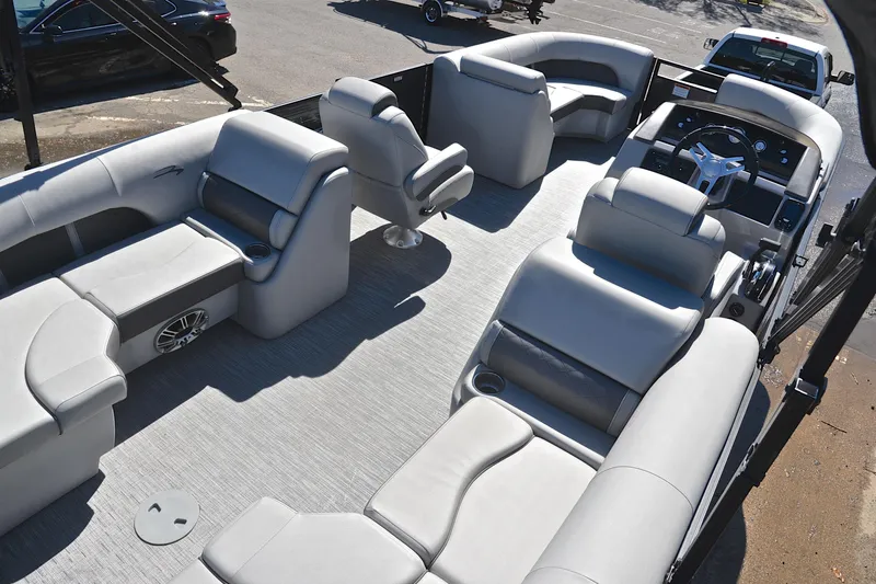 Slide: The Image of 2022 Bennington 22 L pontoon boat interior with plush seating and modern helm. - 19