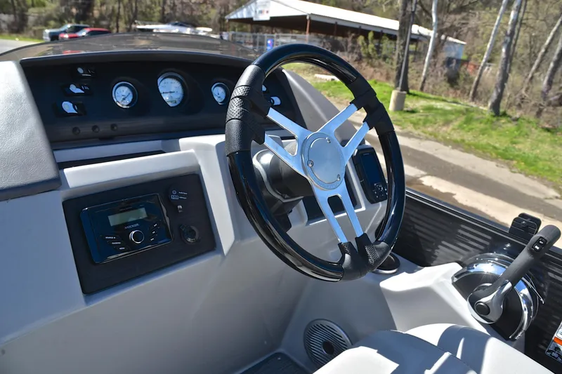 Slide: The Image of Steering console of 2022 Bennington 22 L boat with gauges and controls. - 26