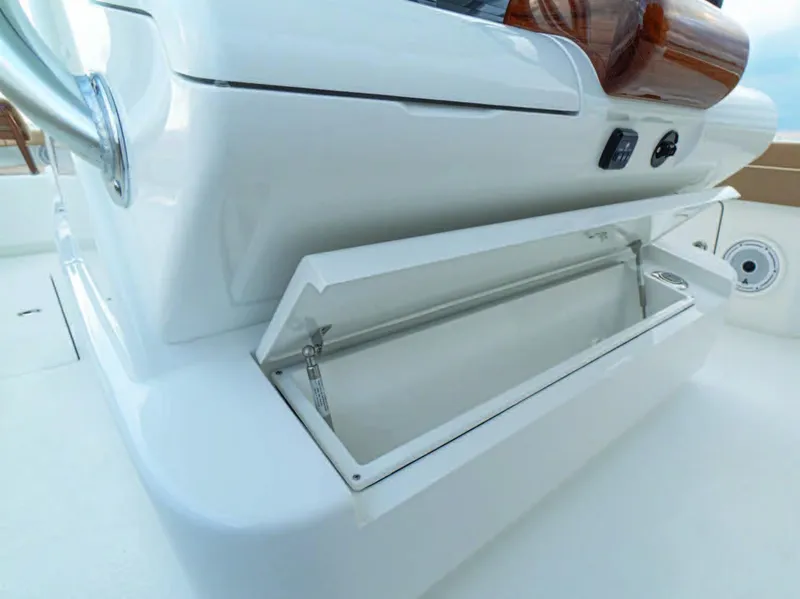 Slide: The Image of 2026 Valhalla Boatworks V-37 storage compartment, open on deck, showcasing sleek design. - 20