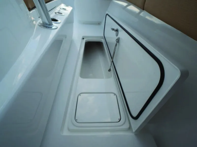 Slide: The Image of 2026 Valhalla Boatworks V-37 storage compartment with open hatch, showcasing sleek design. - 24