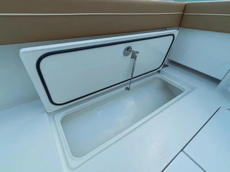 Slide: The Image of 2026 Valhalla Boatworks V-37 storage compartment with open hatch, showcasing interior space. - 3