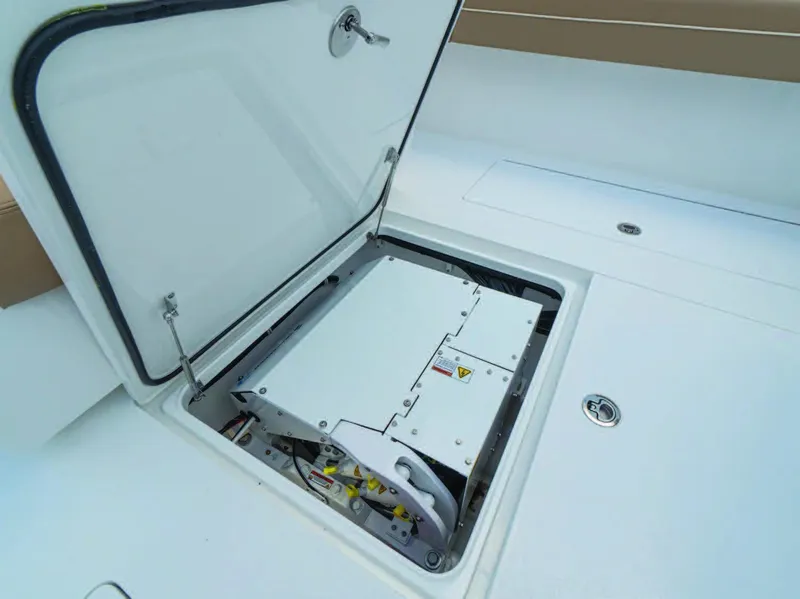 Slide: The Image of 2026 Valhalla Boatworks V-37 storage compartment with open hatch, showcasing interior equipment. - 7