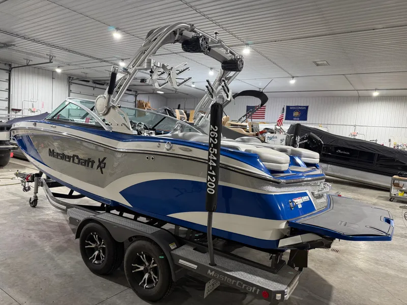Slide: The Image of 2016 MasterCraft X20 boat in a storage facility. - 12