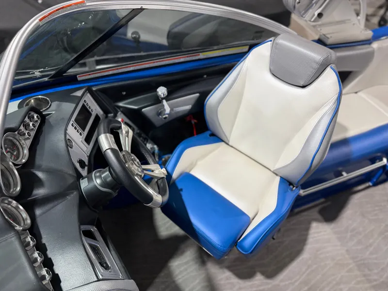 Slide: The Image of Interior of a 2016 MasterCraft X20 boat with steering console. - 30
