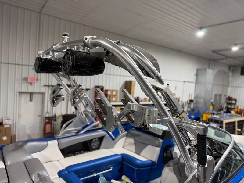 Slide: The Image of 2016 MasterCraft X20 boat with speakers and mounts in workshop. - 4