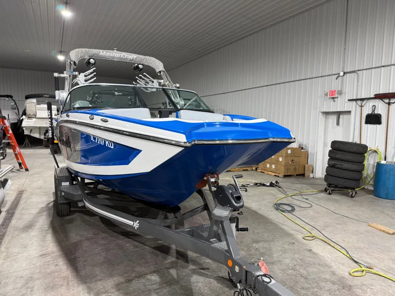 Slide: The Image of 2016 MasterCraft X20 boat in warehouse on trailer. - 8