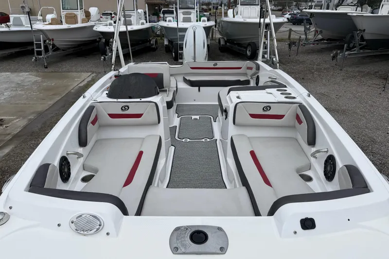 Slide: The Image of 2022 Hurricane SunDeck Sport 205 OB boat interior with seating and cup holders. - 14