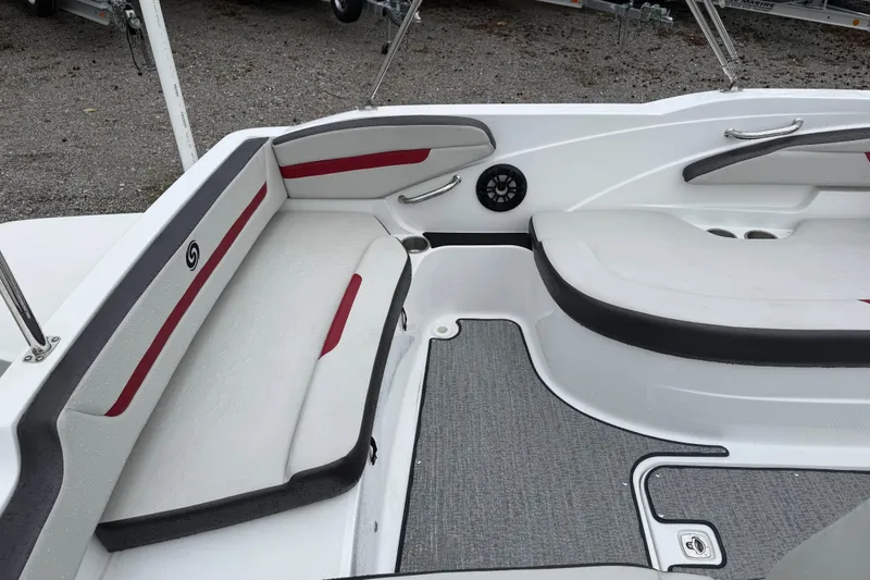 Slide: The Image of Interior seating of 2022 Hurricane SunDeck Sport 205 OB boat, featuring cushioned benches and speaker. - 16
