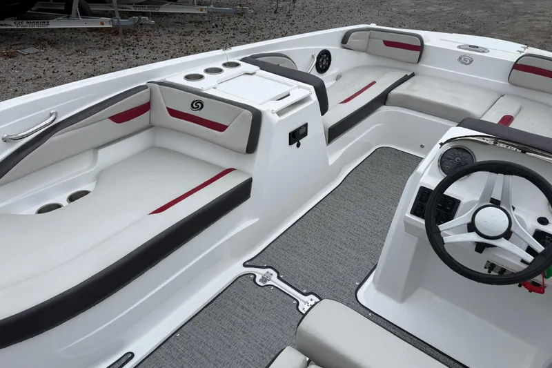 Slide: The Image of 2022 Hurricane SunDeck Sport 205 OB interior with seating and steering wheel. - 17