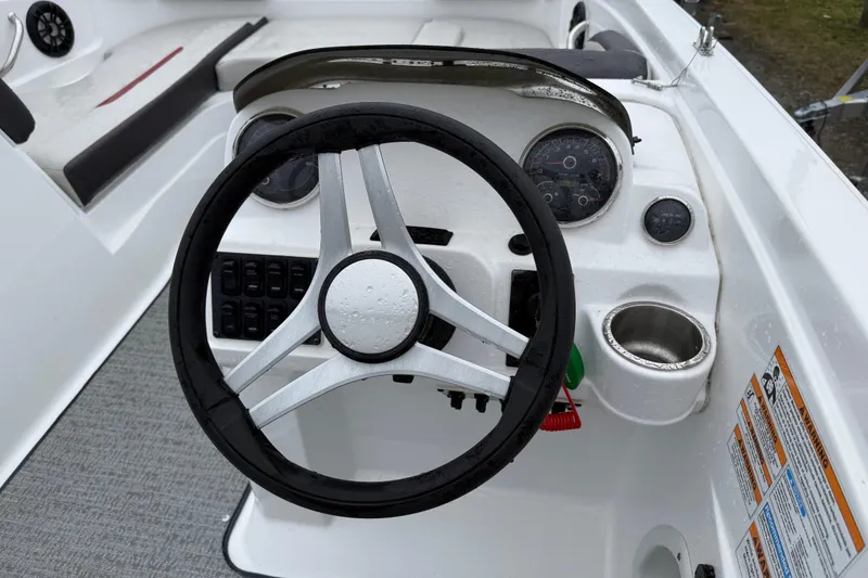 Slide: The Image of Steering console of 2022 Hurricane SunDeck Sport 205 OB boat with gauges and controls. - 19