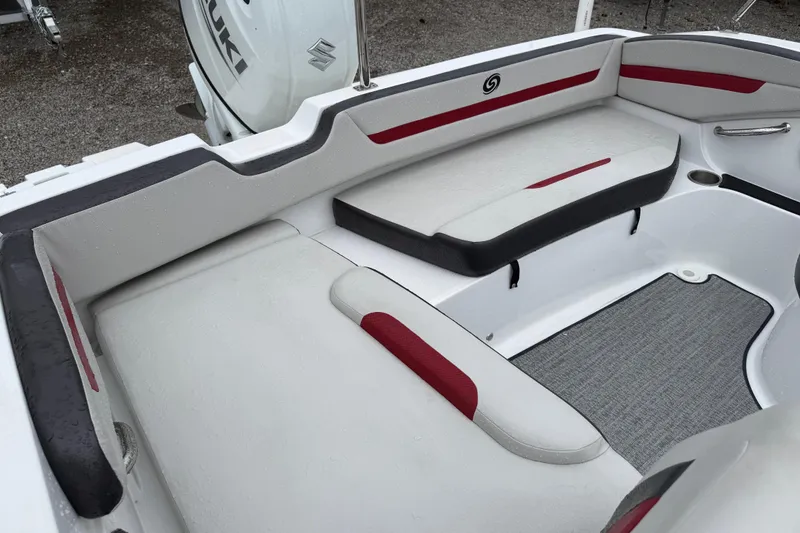 Slide: The Image of 2022 Hurricane SunDeck Sport 205 OB boat interior with red and white seating. - 20
