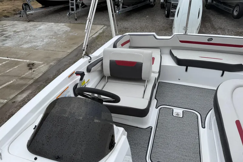 Slide: The Image of 2022 Hurricane SunDeck Sport 205 OB boat interior with seating and steering wheel. - 25