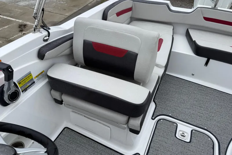 Slide: The Image of 2022 Hurricane SunDeck Sport 205 OB boat interior with cushioned seating and control panel. - 27