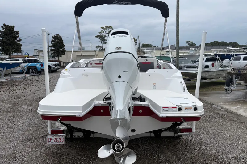 Slide: The Image of 2022 Hurricane SunDeck Sport 205 OB boat, rear view, parked in a marina. - 6