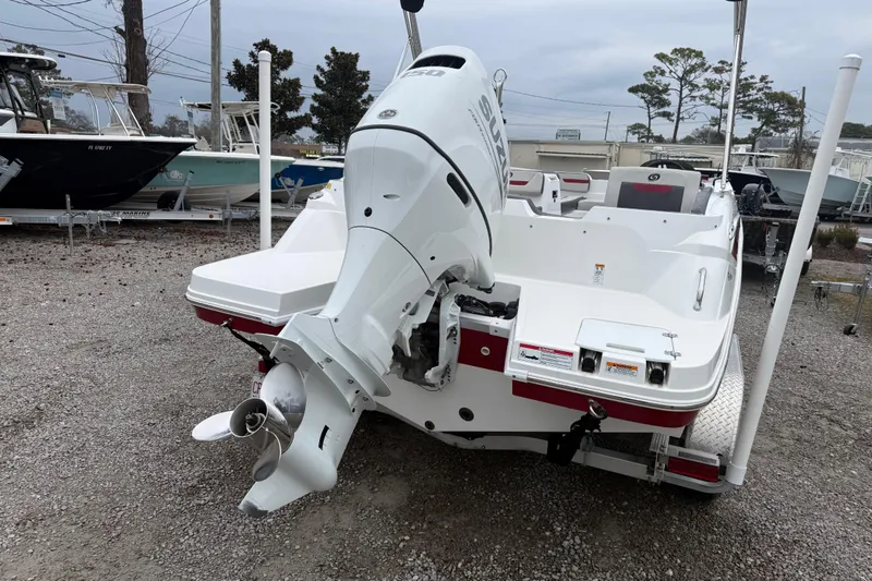 Slide: The Image of 2022 Hurricane SunDeck Sport 205 OB boat with Suzuki outboard motor, parked on gravel. - 7