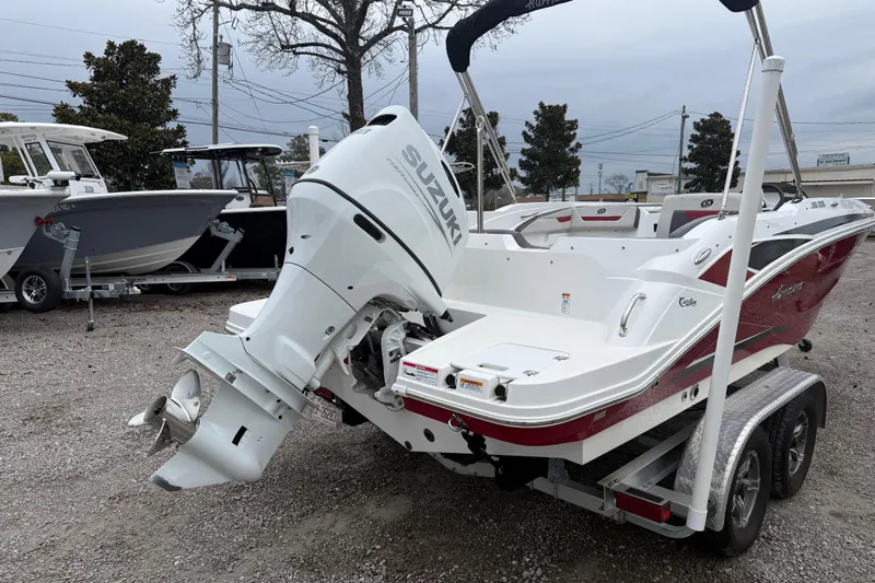 Slide: The Image of 2022 Hurricane SunDeck Sport 205 OB boat with Suzuki outboard motor on trailer. - 8