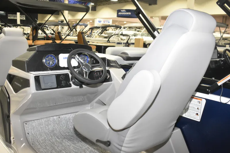 Slide: The Image of 2026 Premier 230 Sunsation Angler 4PT - PTX boat interior with steering console. - 13