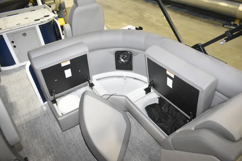 Slide: The Image of Interior of 2026 Premier 230 Sunsation Angler 4PT boat with storage compartments open. - 16