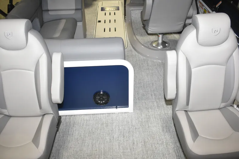 Slide: The Image of Interior of 2026 Premier 230 Sunsation Angler 4PT boat with gray seating and carpet. - 17