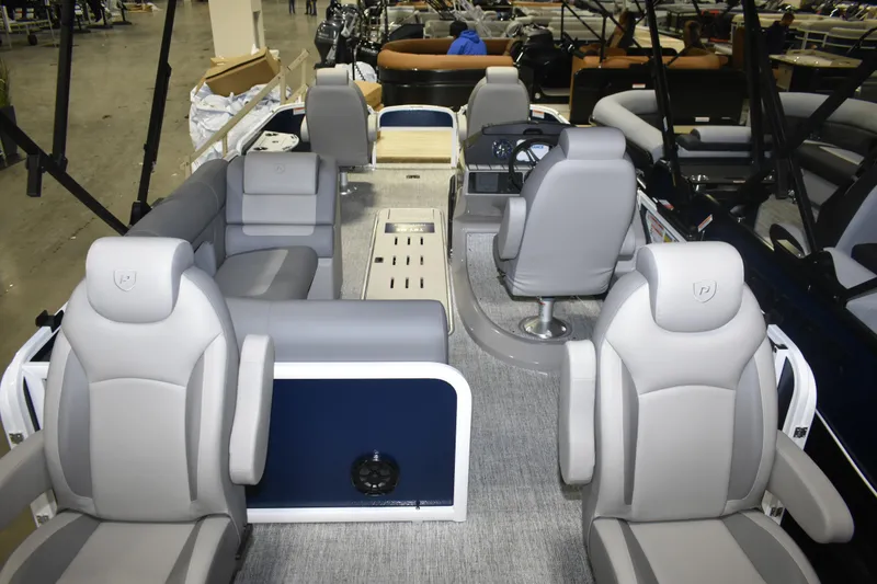 Slide: The Image of 2026 Premier 230 Sunsation Angler 4PT PTX interior with plush seating and modern helm. - 18