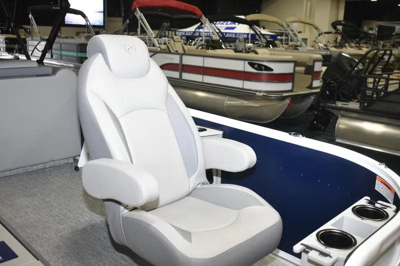 Slide: The Image of Luxurious seating on 2026 Premier 230 Sunsation Angler 4PT boat at a showroom. - 6