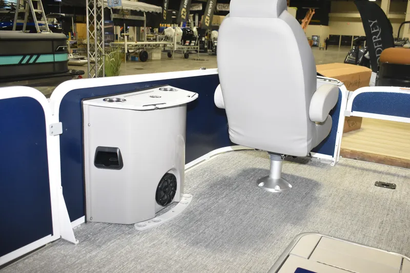 Slide: The Image of 2026 Premier 230 Sunsation Angler 4PT boat interior with seating and storage unit. - 9