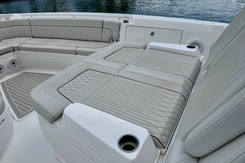 Slide: The Image of Luxurious seating on 2024 Intrepid 427 Nomad SE boat, featuring elegant quilted upholstery. - 11