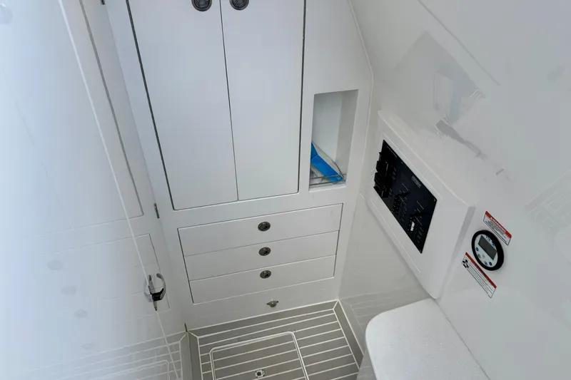 Slide: The Image of 2024 Intrepid 427 Nomad SE interior with storage cabinets and control panel. - 14