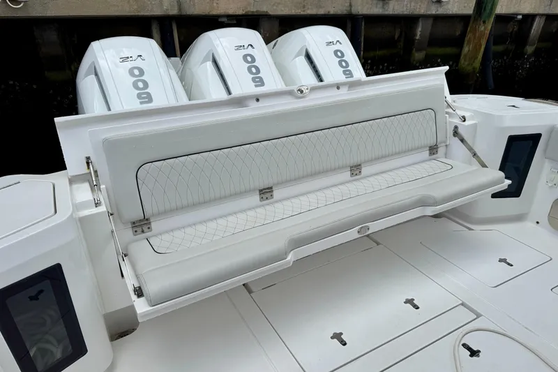 Slide: The Image of 2024 Intrepid 427 Nomad SE boat with foldable seating and powerful engines. - 18