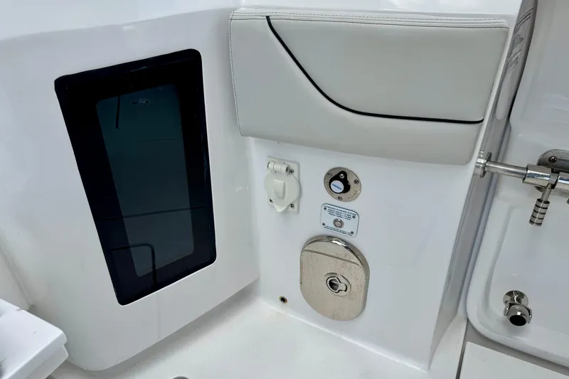 Slide: The Image of 2024 Intrepid 427 Nomad SE boat interior detail with control panel and seating. - 21