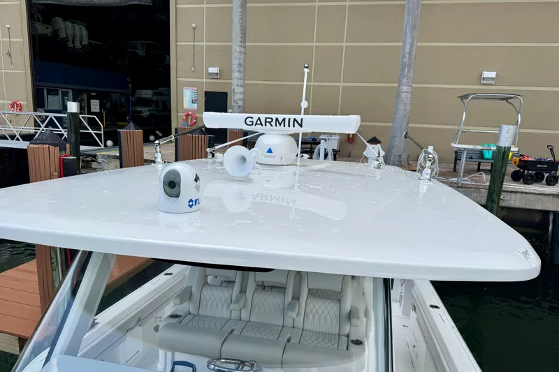 Slide: The Image of 2024 Intrepid 427 Nomad SE boat with Garmin radar and FLIR camera at dock. - 24