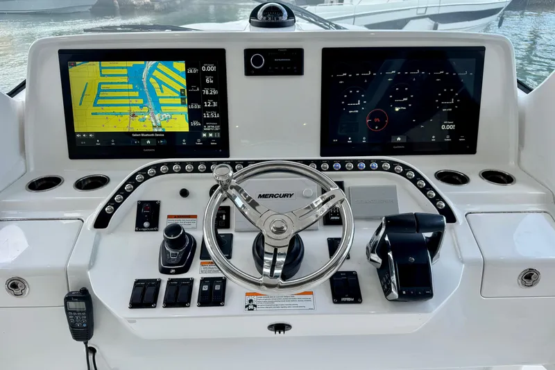 Slide: The Image of Helm of 2024 Intrepid 427 Nomad SE with advanced navigation displays and controls. - 3