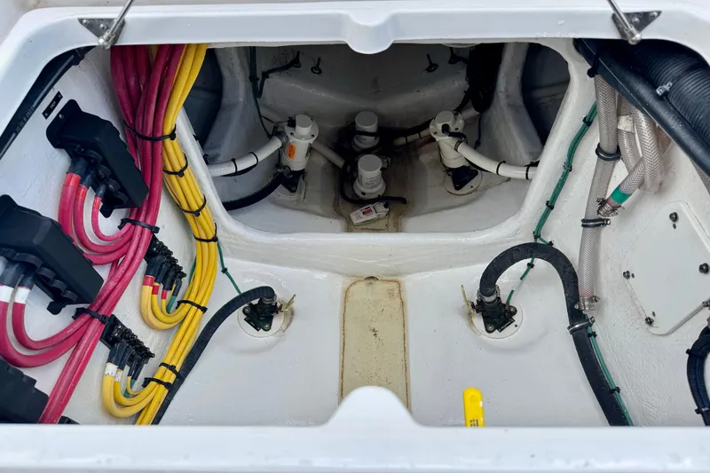 Slide: The Image of Engine compartment of 2024 Intrepid 427 Nomad SE with colorful wiring and hoses. - 37