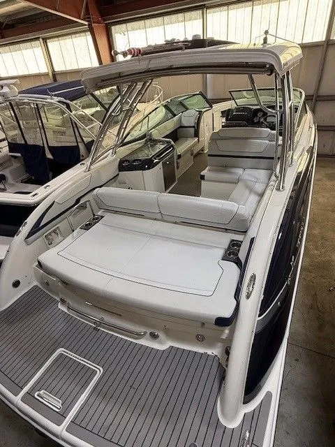 Slide: The Image of 2016 Formula 350 FX Crossover Bowrider in a boat storage facility. - 10