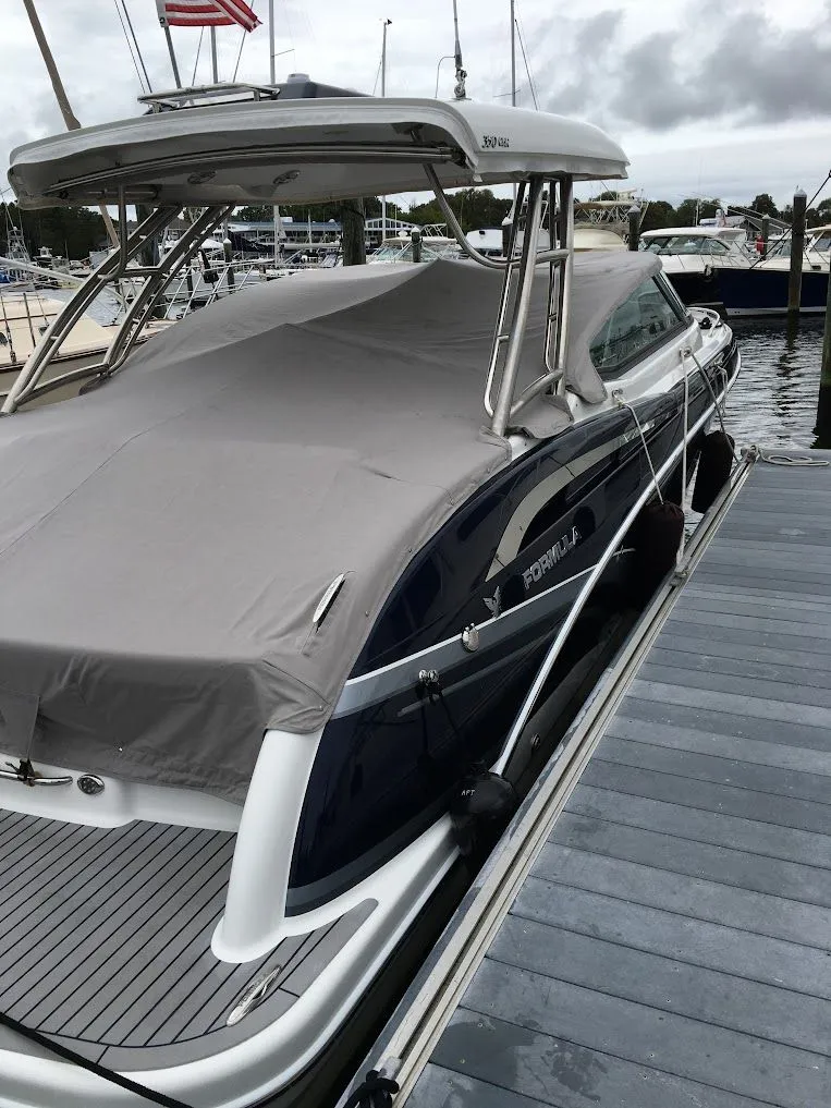 Slide: The Image of 2016 Formula 350 FX Crossover Bowrider docked with cover. - 2