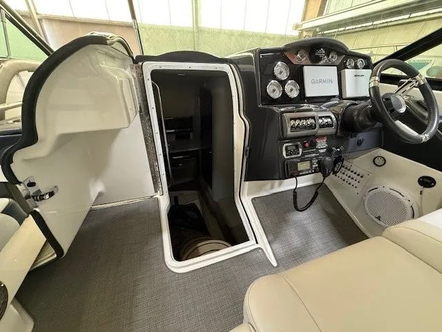 Slide: The Image of Interior of a 2016 Formula 350 FX Crossover Bowrider with helm console. - 26