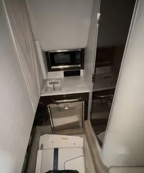 Slide: The Image of Interior of 2016 Formula 350 FX Crossover Bowrider yacht kitchen. - 31