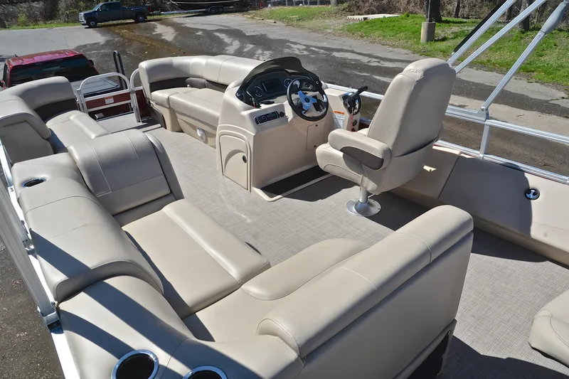 Slide: The Image of 2019 Sun Tracker SportFish 22 DLX pontoon boat with spacious seating and modern helm. - 24