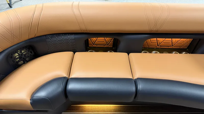 Slide: The Image of Luxurious cushioned seating with brown and black leather, stylish lighting underneath. - 13